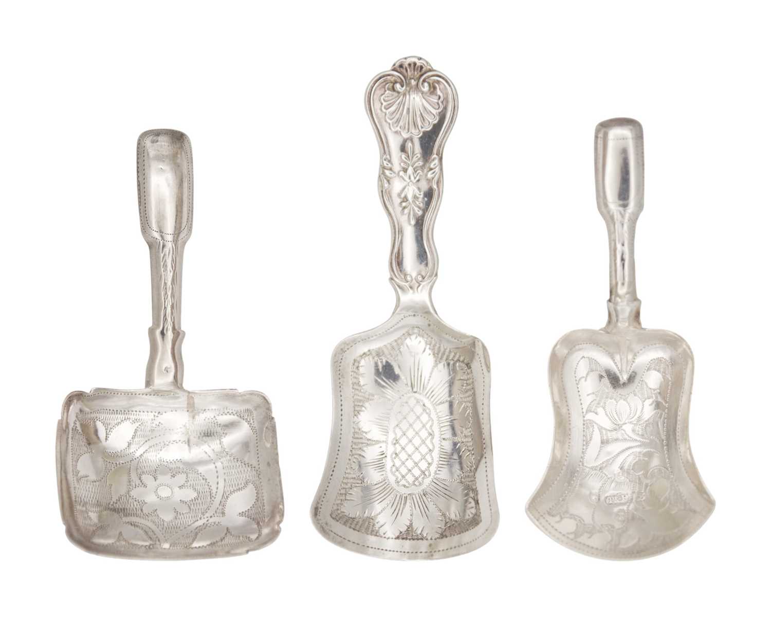 Lot 19 - A selection of three 19th century silver caddy spoons with bright cut shovel shaped bowls.