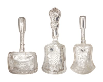 Lot 19 - A selection of three 19th century silver caddy spoons with bright cut shovel shaped bowls.
