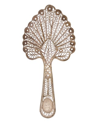 Lot 23 - A rare George III silver filigree caddy spoon.