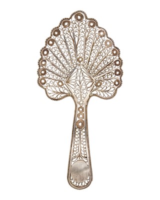 Lot 23 - A rare George III silver filigree caddy spoon.