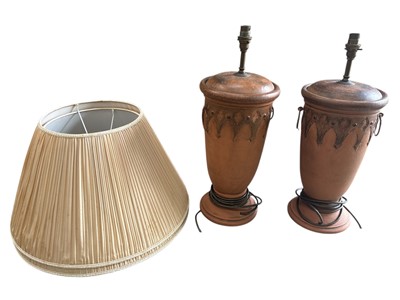 Lot 91 - A pair of terracotta table lamps, both with...
