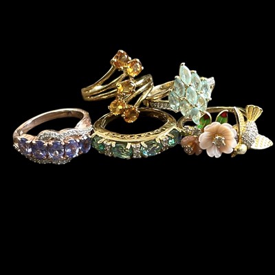 Lot 46 - Five gold-plated silver, stone set rings in...