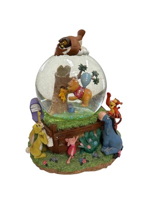 Lot 94 - A Walt Disney 'Winnie The Pooh' snow globe,...