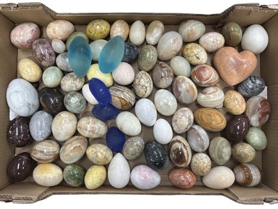Lot 14 - A large collection of stone and glass eggs,...