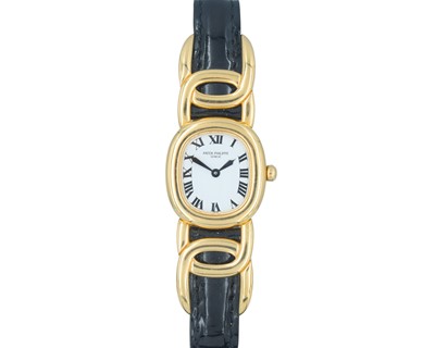 Lot PATEK PHILIPPE - An 18k Golden Ellipse ladies quartz wristwatch.