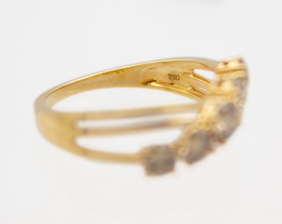 Lot 52 - An 18k gold five-stone champagne diamond ring.