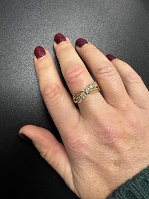 Lot 52 - An 18k gold five-stone champagne diamond ring.