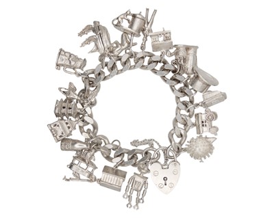 Lot 101 - A heavy silver charm bracelet with a padlock clasp.