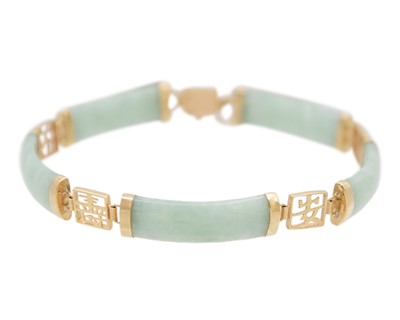 Lot 70 - A Chinese 9k gold jadeite panel bracelet.
