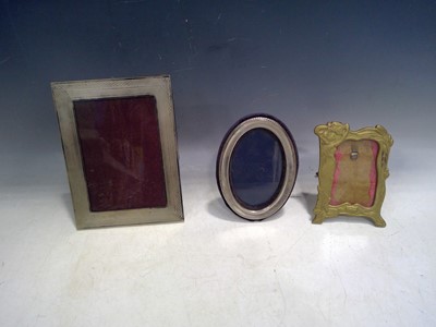 Lot 145 - A Silver Oval Photo Frame, a Brass Art Nouveau...