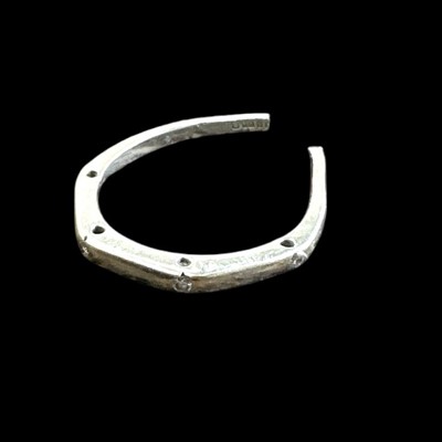 Lot 164 - An 18ct white gold and diamond chip ring,...
