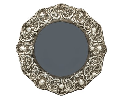 Lot 137 - A Victorian silver-mounted circular photograph frame by Walker & Hall.