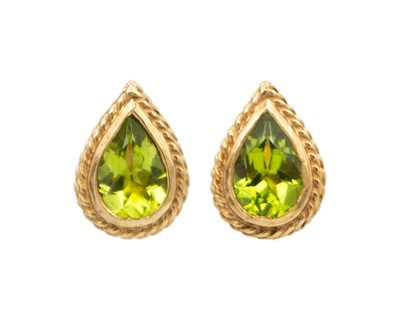 Lot 71 - A pair of 9k gold peridot stud earrings.