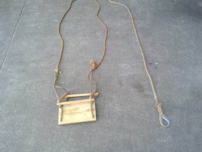 Lot 39 - A Wooden Swing and Rope. The Swing has a drop...