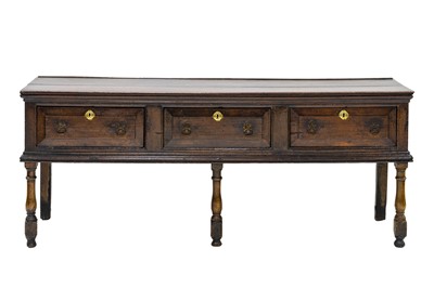 Lot 682 - An oak low dresser.