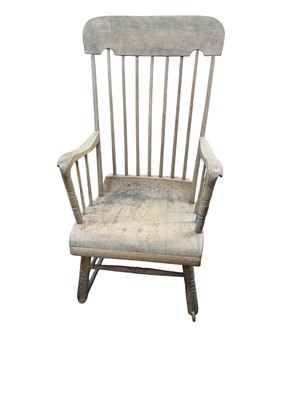 Lot 746 - A late Victorian beech and pine stick back rocking chair.