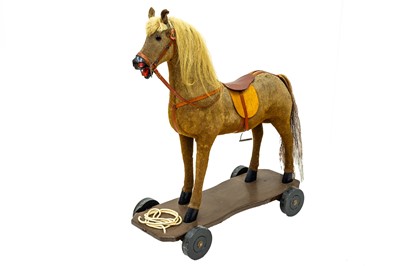 Lot 720 - A child's pull-along toy horse.