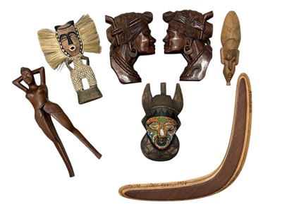 Lot 61 - Tribal wood carvings, including a figural nut...