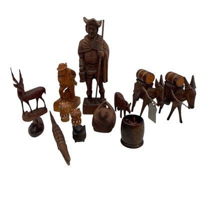 Lot 84 - A collection of Carved wood figures and...