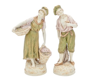 Lot 310 - A pair of Royal Dux porcelain figures depicting a fisherman and fisherwomen.