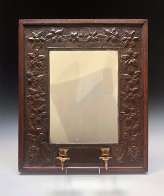 Lot 332 - A patinated brass repousee pier glass with...