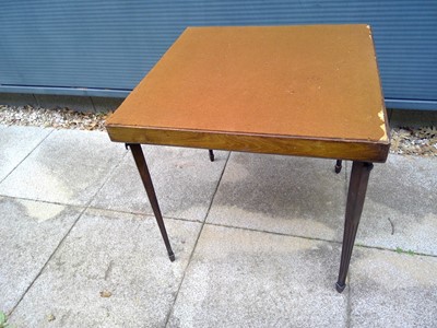 Lot 117 - An Oak Bridge Table with Folding Legs. The...