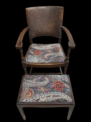Lot 146 - An oak and leather carver chair and a footstool.