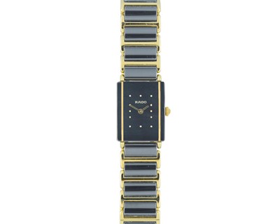 Lot 1053 - RADO - A Diastar quartz lady's ceramic and gilt metal bracelet wristwatch.