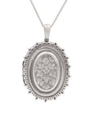 Lot 85 - A large Victorian silver locket pendant necklace.
