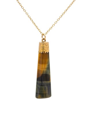 Lot 56 - A Victorian 9k gold tiger's eye pendant on a 9k gold cable chain.