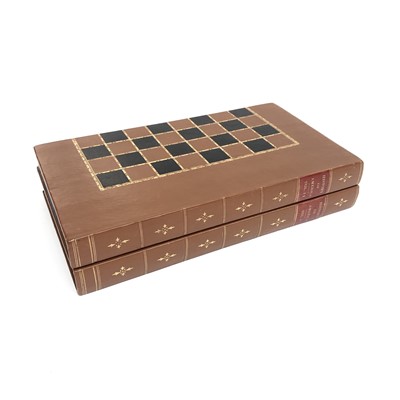 Lot 32 - A Leather bound folding chess board, as two...