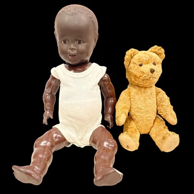Lot 44 - A German Black doll with glass eyes and bone...