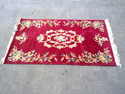 Lot 34 - A 230cm by 120cm Machine Made Rug.