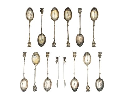Lot 119 - A George V silver cased set of six Lincoln Imp finial teaspoons with tongs.