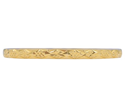 Lot 8 - A high-purity gold faceted bangle.