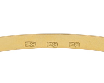 Lot 8 - A high-purity gold faceted bangle.