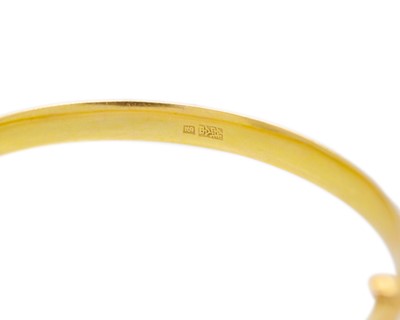Lot 14 - A higher purity gold hinged bangle.