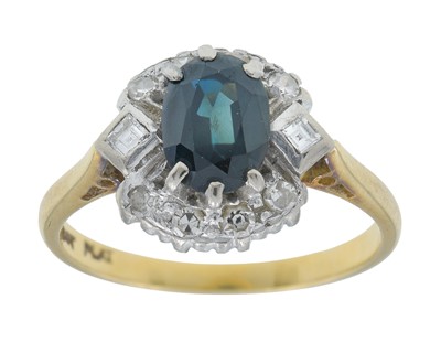 Lot 7 - An 18k gold teal sapphire and diamond cluster ring.