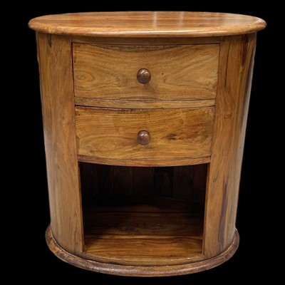 Lot 16 - An Oval Two Drawer Hardwood Nightstand. The...