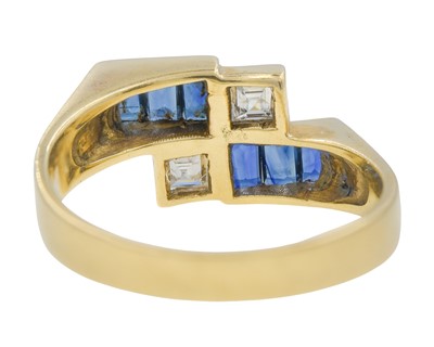 Lot 12 - An 18k gold sapphire and diamond geometrical design ring.