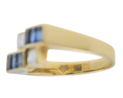 Lot 12 - An 18k gold sapphire and diamond geometrical design ring.