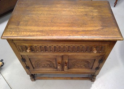 Lot 134 - A Carved Oak Cupboard. The Cupboard is 86cm...