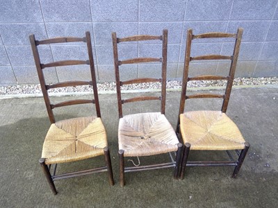 Lot 145 - Three Antique Ladderback Chairs with Cord...