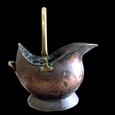Lot 148 - An antique copper and brass helmet scuttle,...