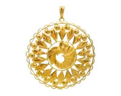 Lot 16 - A 22k gold embossed diamond-cut pendant.