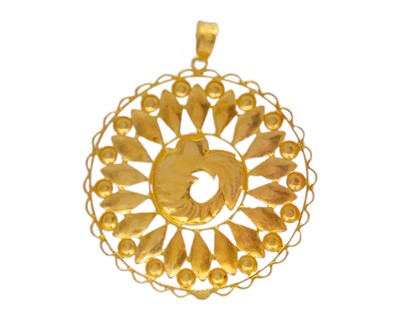 Lot 16 - A 22k gold embossed diamond-cut pendant.