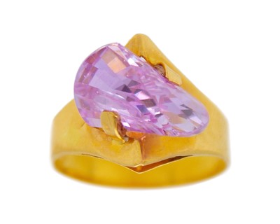 Lot 35 - An unusual design, 21k gold CZ dress ring.