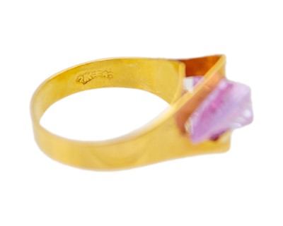 Lot 35 - An unusual design, 21k gold CZ dress ring.