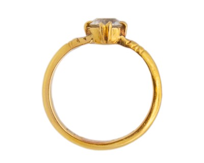 Lot 39 - A high-purity gold and white synthetic sapphire solitaire ring.