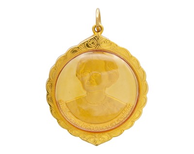 Lot 90 - A Thai 'World Health Organisation' yellow metal coin amulet.
